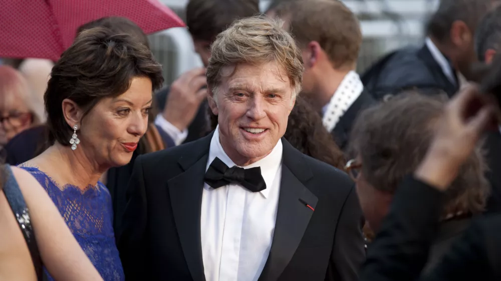 ﻿Actor Robert Redford, centre, and his wife Sibylle Szaggars, centre left, arrive for the screening of All Is Lost at the 66th international film festival, in Cannes, southern France, Wednesday, May 22, 2013. (AP Photo/Virginia Mayo)