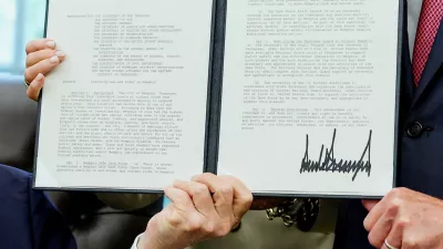 U.S. President Donald Trump and U.S. Senators Marsha Blackburn (R-TN) and Bill Hagerty (R-TN) hold a memorandum Trump just signed to send federal resources to Memphis, Tennessee, for a surge against local crime, in the Oval Office at the White House in Washington, D.C., U.S., September 15, 2025. REUTERS/Jonathan Ernst REFILE - CORRECTING THE TITLES OF BLACKBURN AND HAGERTY FROM "TENNESSEE SENATORS" TO "U.S. SENATORS".