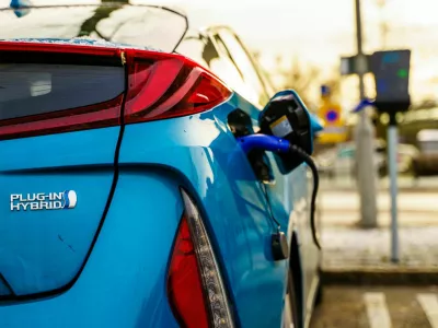 Gothenburg, Sweden - December 1, 2019: Electric plug in hybrid car parked on street parking lot for charging