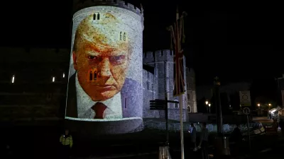 U.S. President Donald Trump's mugshot is projected on Windsor castle, after U.S. President Donald Trump and first lady Melania Trump arrival for a state visit to the country, in Windsor, Berkshire, Britain September 16, 2025. REUTERS/Phil Noble
