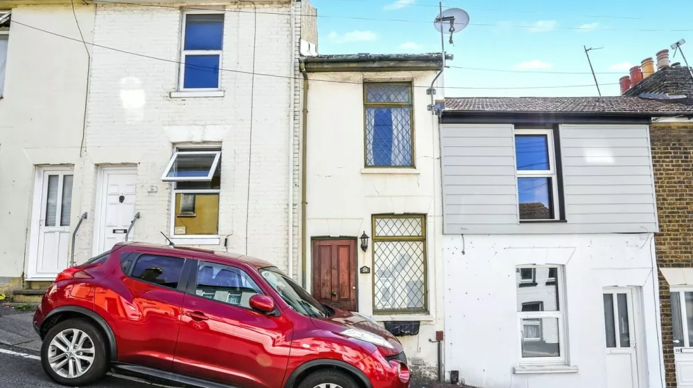The 7ft wide Victorian property in Chatham, Kent. One of Britain's thinnest homes is up for auction - a two-bedroom terrace house standing at just 7ft wide. The empty Victorian property in Chatham, Kent, is being auctioned this week with a guide price of just �75,000. The fixer-upper has a bedroom which is a tiny 4ft 7ins wide and the total floorspace for the house is a measly 49 sq metres. Photo released 15/09/2025,Image: 1037660187, License: Rights-managed, Restrictions: Editorial use, commercial use may require additional licenses. We don't use AI to make images which could be mistaken for news photos. AI use will be clearly indicated. Supplied on condition you ensure personal data is processed in compliance with UK GDPR, Model Release: no