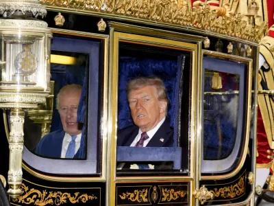 17 September 2025, United Kingdom, Windsor: Britain's King Charles III and US President Donald Trump during the carriage procession to Windsor Castle, Berkshire, ahead of the ceremonial welcome on day one of the US President's second state visit to the UK. Photo: Jordan Pettitt/PA Wire/dpa