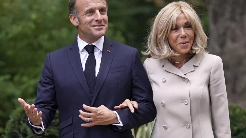 FILE - French President Emmanuel Macron and wife Brigitte arrive at 10 Downing Street in London, Wednesday, July 9, 2025.(AP Photo/Alberto Pezzali, Pool, File)