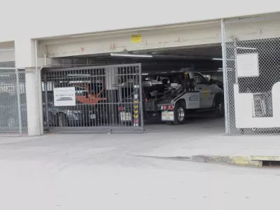 Hollywood towing yard where a rotting body found inside impounded Tesla registered to singer D4vd, Los Angeles police say.09 Sep 2025Pictured: d4vd impounded Tesla where body was found - Hollywood Tow.,Image: 1035583144, License: Rights-managed, Restrictions: World Rights, Model Release: no