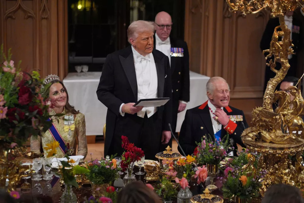 U.S. President Donald Trump delivers his speech as Britain's King Charles and Kate, Princess of Wales, listen during the State Banquet in Windsor Castle, England, on day one of U.S. President Donald Trump and First Lady Melania Trump's second state visit to the UK, Wednesday Sept. 17, 2025. (Yui Mok/PA via AP, Pool Photo via AP)
