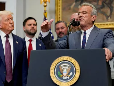 FILE PHOTO: U.S. Health and Human Services Secretary Robert F. Kennedy Jr. gestures as he delivers remarks next to U.S. President Donald Trump in the Roosevelt Room at the White House in Washington, D.C., U.S., July 31, 2025. REUTERS/Kent Nishimura/File Photo