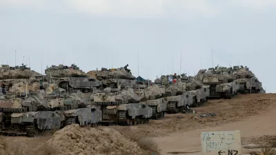 Israeli tanks stand near the Israel-Gaza border, as seen from Israel, September 19, 2025. REUTERS/Ammar Awad