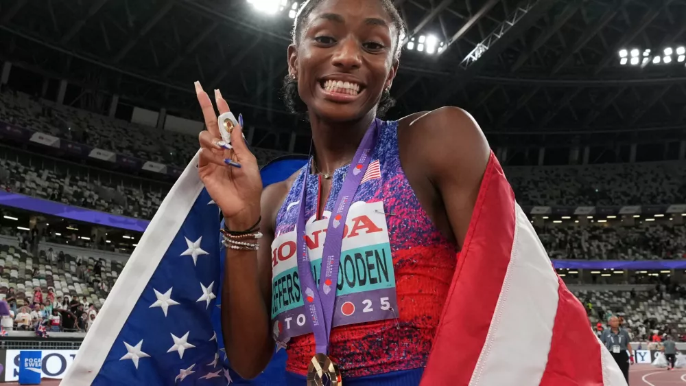 World Athletics Championships Tokyo 2025 - Women's 200m Final - Japan National Stadium, Tokyo, Japan - September 19, 2025 Melissa Jefferson-Wooden of the U.S. celebrates after winning the gold medal REUTERS/Aleksandra Szmigiel