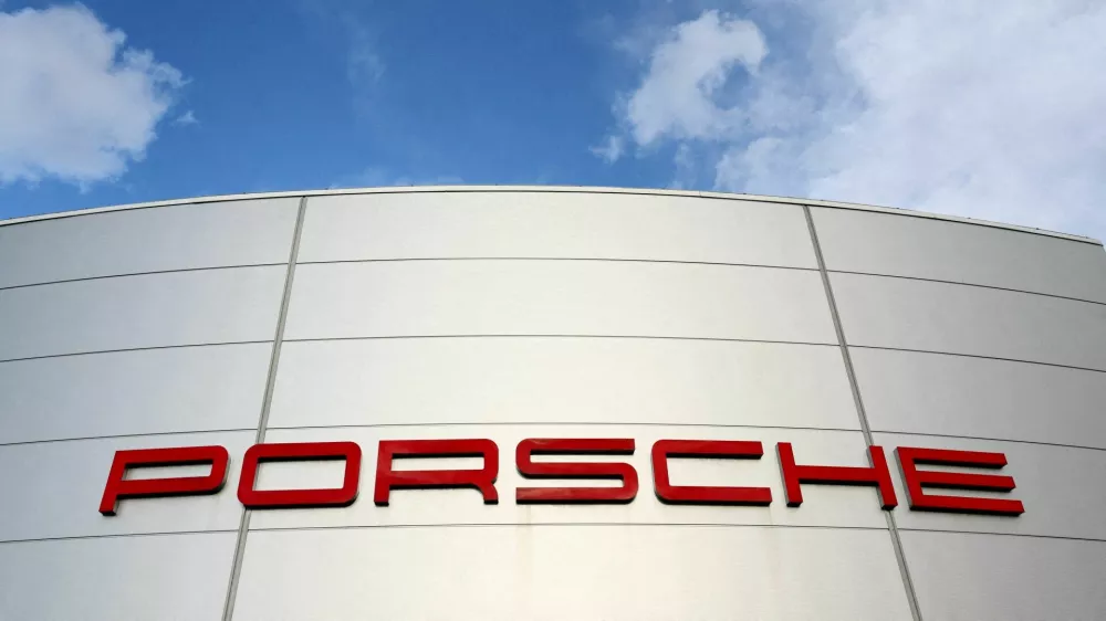 FILE PHOTO: A logo of Porsche is seen outside a Porsche car dealer in Brussels, Belgium March 13, 2023. REUTERS/Yves Herman/File Photo/File Photo