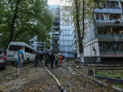 Firefighters work at the site of apartment buildings hit during a Russian missile strike, amid Russia's attack on Ukraine, in Dnipro, Ukraine September 20, 2025. REUTERS/Mykola Synelnykov