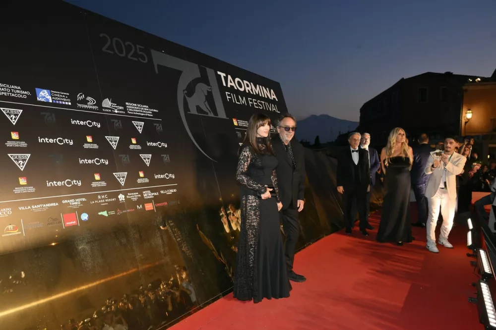 Taormina, Italy: Taormina: Hotel Metropole: 71Â° Taormina Film Festival, Closing Cocktail. In the photo: Monica Bellucci, Tim Burton,Image: 1011308358, License: Rights-managed, Restrictions: * Italy Rights OUT *, Model Release: no