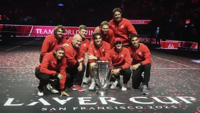 Team World players celebrate after defeating Team Europe on the third day to win the Laver Cup tennis tournament in San Francisco, Sunday, Sept. 21, 2025. (AP Photo/Jeff Chiu)