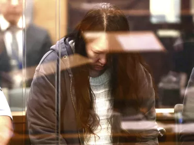 FILE - Hakyung Lee stands in the dock at the High Court in Auckland, New Zealand, Monday, Sept. 8, 2025. (Lawrence Smith/Stuff Pool Photo via AP, File)