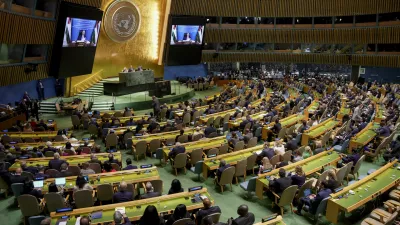 Palestinian President Mahmoud Abbas appears on a screen as he speaks virtually during a high-profile meeting at the United Nations aimed at galvanizing support for a two-state solution to the Israeli-Palestinian conflict Monday, Sept. 22, 2025, at UN headquarters. (AP Photo/Angelina Katsanis)