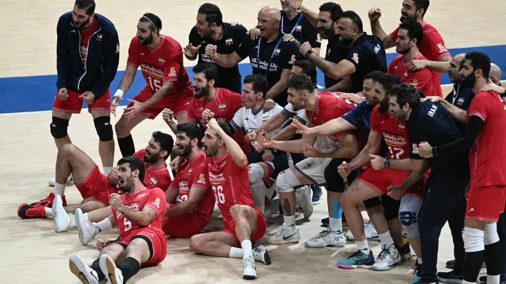 Volleyball - Men's World Championships - Round of 16 - Serbia v Iran - SM Mall of Asia Arena, Pasay City, Philippines - September 23, 2025 Iran players celebrate after the match REUTERS/Noel Celis