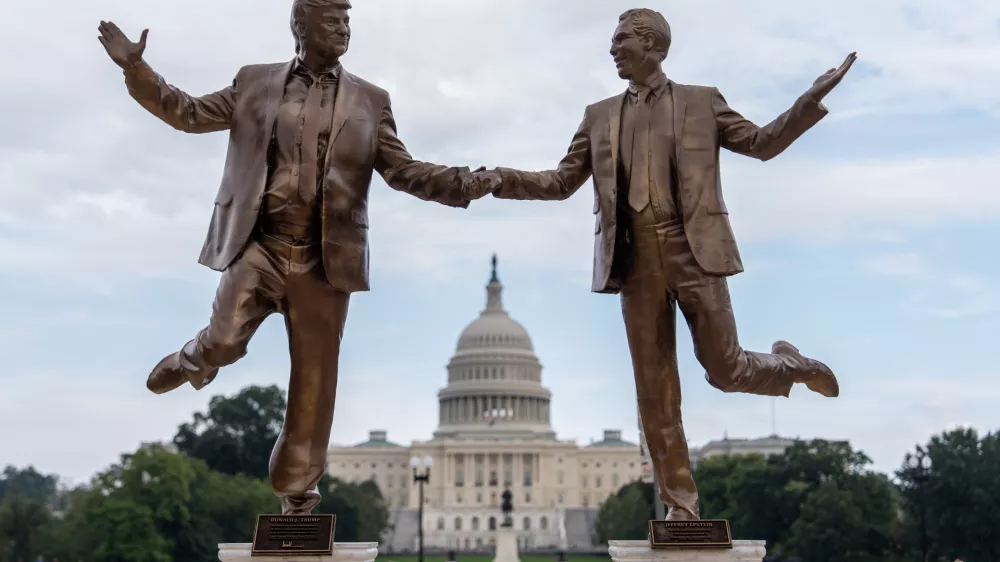 A work of protest art representing President Donald Trump and Jeffrey Epstein is seen on the National Mall near the Capitol, Tuesday, Sept. 23, 2025, in Washington. (AP Photo/Julia Demaree Nikhinson)