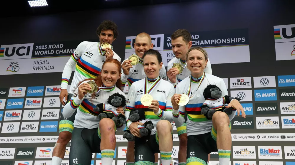 Cycling - Road World Championships 2025 - Kigali, Rwanda - September 24, 2025  Australia's Michael Matthews, Lucas Plapp, Jay Vine, Brodie Chapman, Amanda Spratt and Felicity Wilson-Haffenden celebrate on the podium after winning the team time trial mixed relay REUTERS/Jean Bizimana