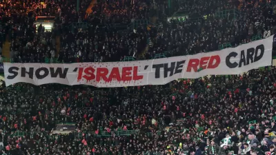FILE - Celtic fans lift a protest banner about Israel during the Champions League playoff first leg soccer match between Glasgow Celtic and Bayern Munich at the Celtic Park Stadium in Glasgow, Scotland, Wednesday, Feb. 12, 2025. (AP Photo/Scott Heppell, File)