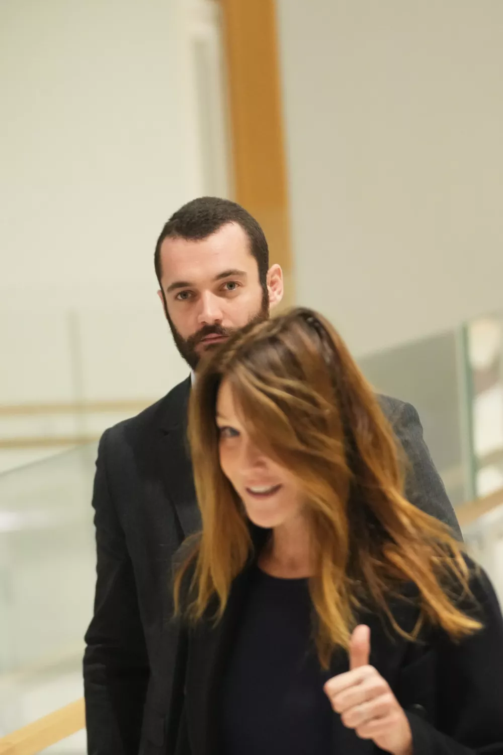 Former French President Nicolas Sarkozy's son Louis Sarkozy, background, and Carla Bruni arrive to the courthouse, in Paris, France, Thursday, Sept. 25, 2025. (AP Photo/Christophe Ena)
