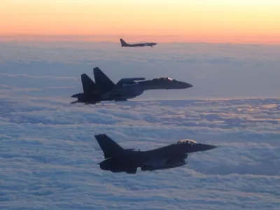 In this image released by the Department of Defense, a North American Aerospace Defense Command F-16 Fighting Falcon fighter aircraft, foreground, escorts a Russian Su-35 fighter, center, and Tu-95 Bear bomber through the Alaskan Air Defense Identification Zone over the Bering Sea Sept. 24, 2025.(U.S. Department of Defense photo)