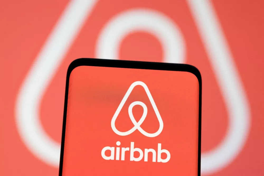 FILE PHOTO: Airbnb logo is seen displayed in this illustration taken, May 3, 2022. REUTERS/Dado Ruvic/Illustration/File Photo