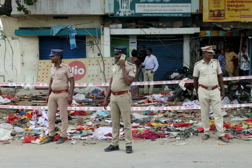 Police officers stand guard at the site following a stampede incident during a election campaign rally held by Tamilaga Vettri Kazhagam party, in Karur district of Tamil Nadu, India, September 28, 2025. REUTERS/Priyanshu Singh