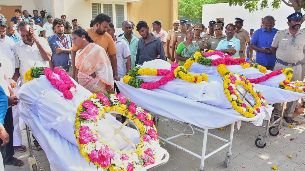 Relatives of people who were killed in a stampede during a rally for a popular Indian actor and politician, mourn as they take the bodies from a hospital, in Karur, in the southern state of Tamil Nadu, Sunday, Sept. 28, 2025. (AP Photo)