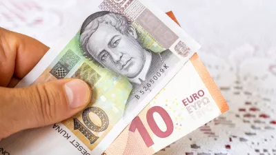 Money in hand, Croatian kuna and Euro, Concept of Croatians joining the euro zone and currency exchange