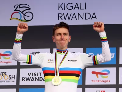Cycling - Road World Championships 2025 - Kigali, Rwanda - September 28, 2025 Slovenia's Tadej Pogacar celebrates on the podium after winning the Men's Elite Road Race REUTERS/Jean Bizimana