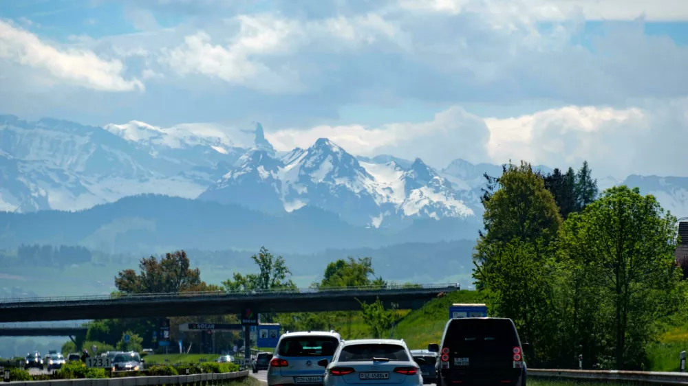 MKHR75 Highway traffic with a mountain range in the background, Switzerland, Europe