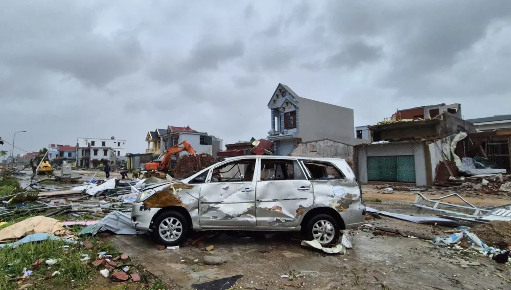 A damaged car is seen amid debris and other damaged buildings after Typhoon Bualoi swept through Thanh Hoa, Vietnam, Monday, Sept. 29, 2025. (Viet Hoang/VNExpress via AP)