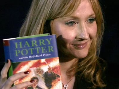 **FILE** British author J.K. Rowling holds a copy of her latest book, "Harry Potter and the Half-Blood Prince", in Edinburgh, Scotland,in a Friday, July 15, 2005 file photo. Rowling expects to have a busy 2006, the year,she says, that she will write the final book in the Harry Potter series. (AP Photo/Matt Dunham, File)