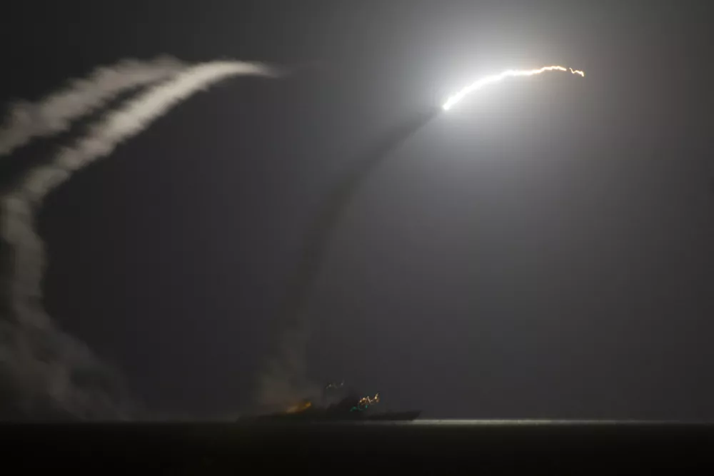 ﻿In this photo released by the U.S. Navy, the guided-missile cruiser USS Philippine Sea launches a Tomahawk cruise missile at Islamic State group positions in Syria as seen from the aircraft carrier USS George H.W. Bush in the Arabian Gulf on Tuesday, Sept. 23, 2014. Syria said Tuesday that Washington informed President Bashar Assad's government of imminent U.S. airstrikes against the Islamic State group, hours before an American-led military coalition pounded the extremists' strongholds across northern and eastern Syria.(AP Photo/Eric Garst, U.S. Navy)