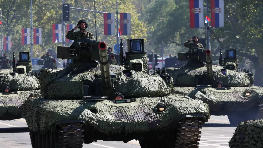 Serbian army soldiers ride on a military vehicles during a military parade in Belgrade, Serbia, September 20, 2025. REUTERS/Zorana Jevtic