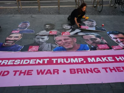 Relatives and supporters of hostages held by Hamas in the Gaza Strip calling for their immediate release and an end of the ongoing war, in front of the U.S. Embassy branch office in Tel Aviv, Israel, Monday, Sept. 29, 2025, During the meeting between U.S. President Donald Trump and Israeli Prime Minister Benjamin Netanyahu in the White House. (AP Photo/Ariel Schalit)