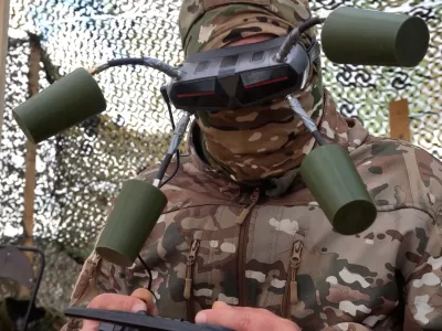 In this photo taken from video distributed by Russian Defense Ministry Press Service on Tuesday, Sept. 30, 2025, A Russian soldier controls a drone for an action in an undisclosed location in Ukraine. (Russian Defense Ministry Press Service via AP)