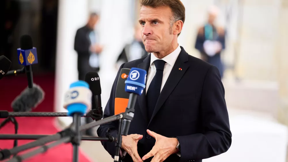 French President Emmanuel Macron arrives at an informal summit in the Danish parliament at Christiansborg Castle in Copenhagen, Wednesday, Oct. 1, 2025. (Thomas Traasdahl/Ritzau Scanpix via AP)
