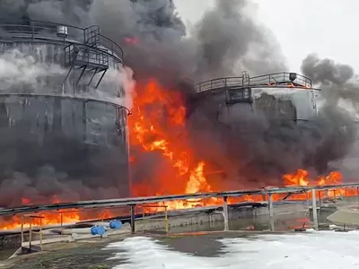 In this photo taken from video released by Governor of Bryansk Region Alexander Bogomaz telegram channel AV BogomaZ on Friday, Jan. 19, 2024, Oil reservoirs are seen in fire after the drone reached Klintsy, a city in Bryansk Region of Russia, about 60 kilometers (40 miles) from the Russia-Ukrainian border. A Russian official says a Ukrainian drone has struck an oil storage depot in western Russia, causing a massive blaze. (Governor of Bryansk Region Alexander Bogomaz telegram channel AV BogomaZ via AP)