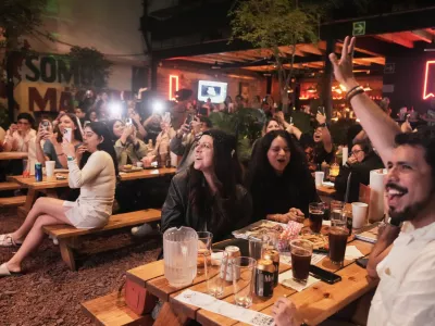 Fans gather to celebrate the release of Taylor Swift's new album, "The Life of a Showgirl" in Mexico City, Thursday, Oct. 2, 2025. (AP Photo/Claudia Rosel)