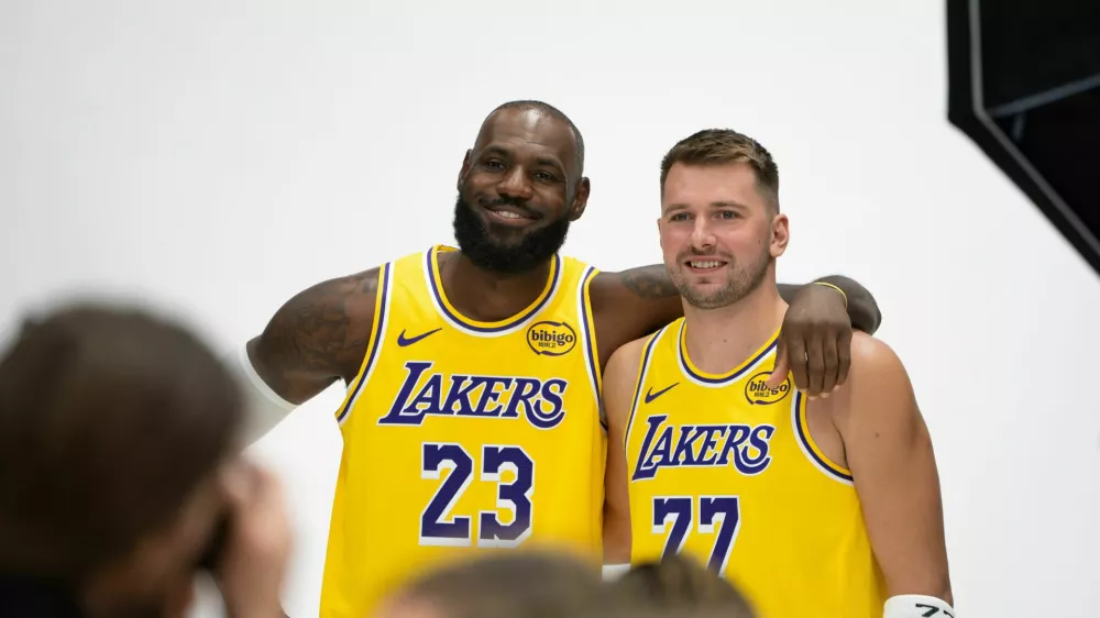 Los Angeles Lakers' LeBron James (23) poses with Luka Doncic (77) during the NBA basketball team's media day in El Segundo, Calif., Monday, Sept. 29, 2025. (AP Photo/Jae C. Hong)