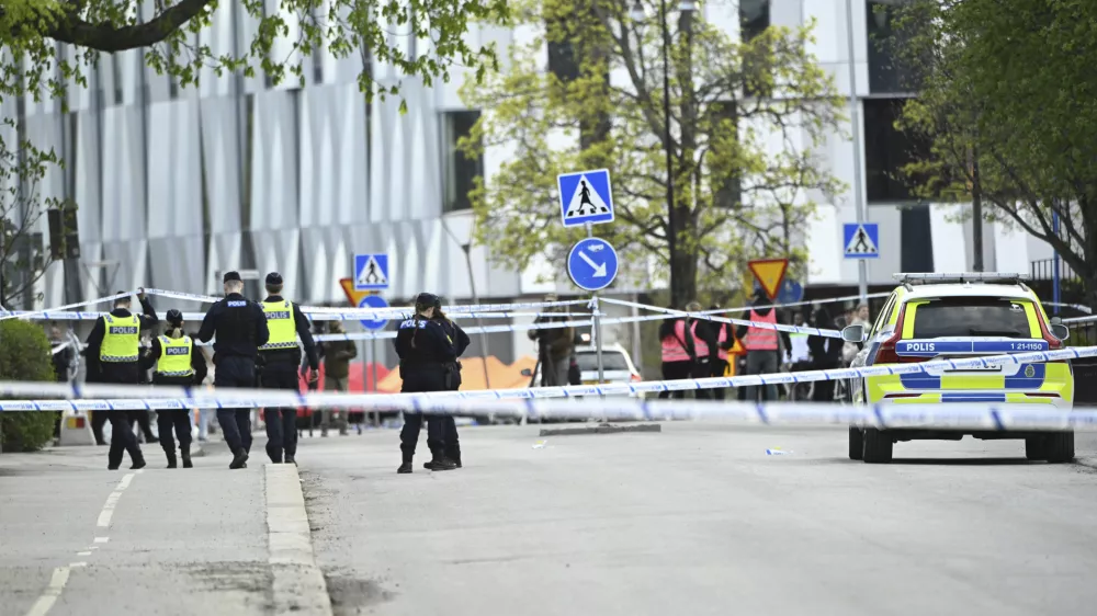 Police at the scene after a shooting incident, at Vaksala Square, in central Uppsala, Sweden, Tuesday, April 29, 2025. (Fredrik Sandberg/TT News Agency via AP)