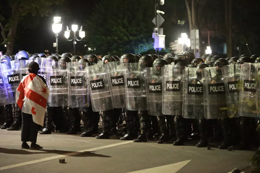 Police block protesters during an opposition rally in the city center of Tbilisi, Georgia, on Saturday, Oct. 4, 2025, boycotting the municipal elections and call for the release of political opponents. (AP Photo/Zurab Tsertsvadze)