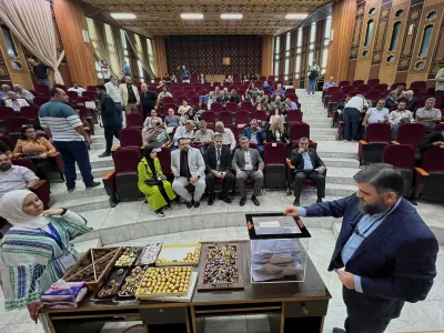 A Syrian electoral college member, right, casts his vote during the parliamentary elections at Latakia's Governor ballot station, in the coastal city of Latakia, Syria, Sunday, Oct. 5, 2025. (AP Photo/Hussein Malla)