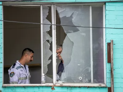 A police officer works at the site of a shooting incident, where multiple people were wounded on Sunday, in Croydon Park in Sydney, Australia, October 6, 2025. AAP/Sitthixay Ditthavong via REUTERS  ATTENTION EDITORS - THIS IMAGE WAS PROVIDED BY A THIRD PARTY. NO RESALES. NO ARCHIVE. AUSTRALIA OUT. NEW ZEALAND OUT. NO COMMERCIAL OR EDITORIAL SALES IN NEW ZEALAND. NO COMMERCIAL OR EDITORIAL SALES IN AUSTRALIA.   TPX IMAGES OF THE DAY