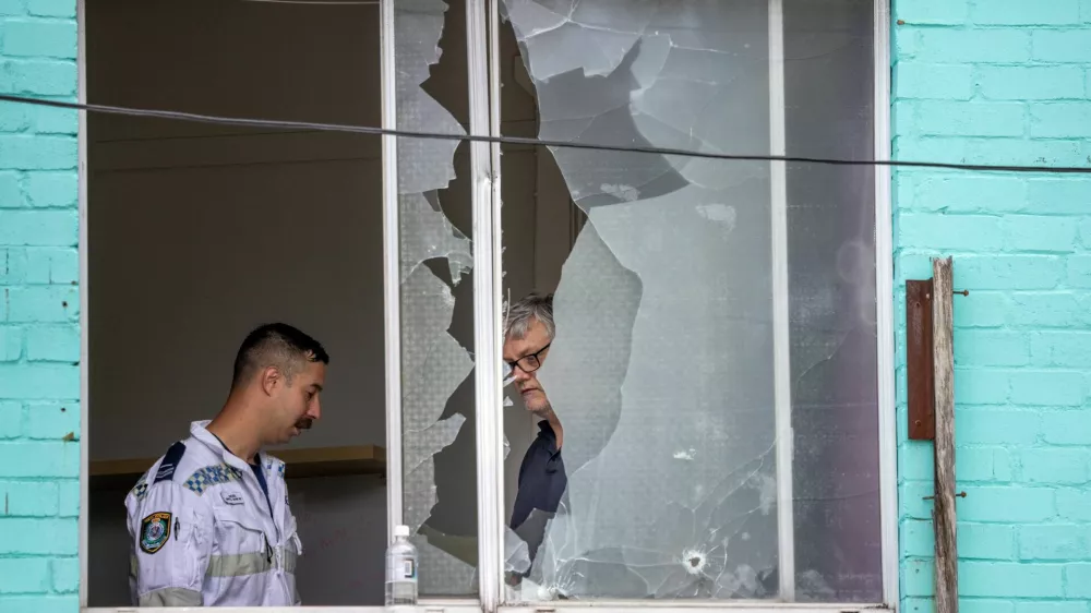 A police officer works at the site of a shooting incident, where multiple people were wounded on Sunday, in Croydon Park in Sydney, Australia, October 6, 2025. AAP/Sitthixay Ditthavong via REUTERS  ATTENTION EDITORS - THIS IMAGE WAS PROVIDED BY A THIRD PARTY. NO RESALES. NO ARCHIVE. AUSTRALIA OUT. NEW ZEALAND OUT. NO COMMERCIAL OR EDITORIAL SALES IN NEW ZEALAND. NO COMMERCIAL OR EDITORIAL SALES IN AUSTRALIA.   TPX IMAGES OF THE DAY