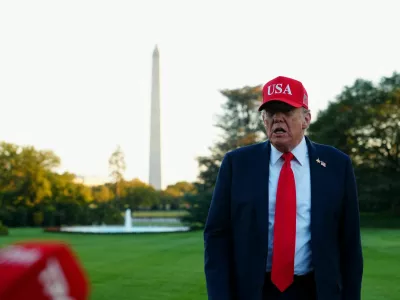 U.S. President Donald Trump speaks to members of the media as he arrives at the White House in Washington, D.C., U.S., October 5, 2025. REUTERS/Aaron Schwartz