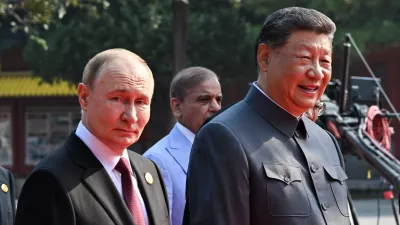 03 September 2025, China, Beijing: Russian President Vladimir Putin (L) and Chinese President Xi Jinping arrive for China's Victory Day military parade marking the 80th anniversary of victory over the militarist Japan and the end of World War II. Photo: Sergei Bobylev/TASS via ZUMA Press/dpa