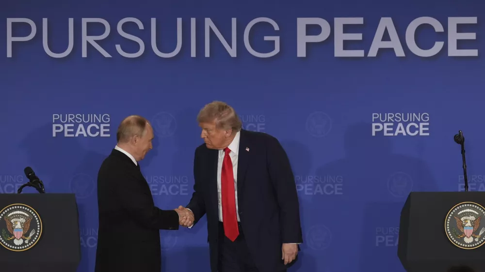 President Donald Trump, right, shakes the hand of Russia's President Vladimir Putin during a joint press conference at Joint Base Elmendorf-Richardson, Alaska, Friday, Aug. 15, 2025. (AP Photo/Jae C. Hong)