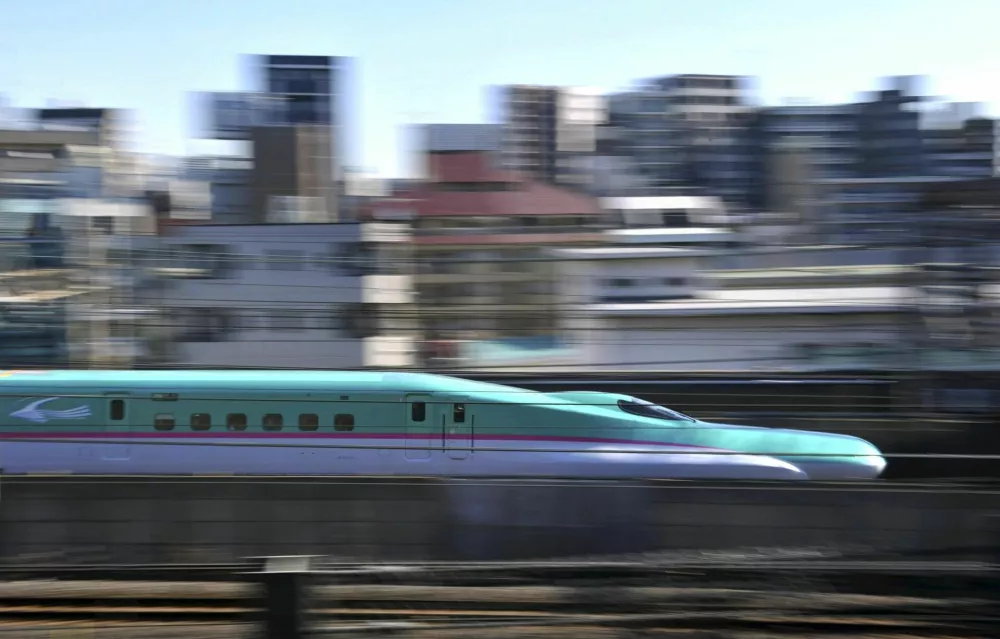 ﻿"Hayabusa'' a new shinkansen train makes its debuting operation on the Tohoku Shinkansen Line on Saturday, in Arakawa Ward in Tokyo, March 5, 2011. East Japan Railway, Co. launched the thin-nosed green bullet train, operating 300 kilometer per hour to make a trip from Tokyo to Shin-Aomori, the 675 kilometer distance in three hours and 10 minutes. (The Yomiuri Shimbun via AP Images)