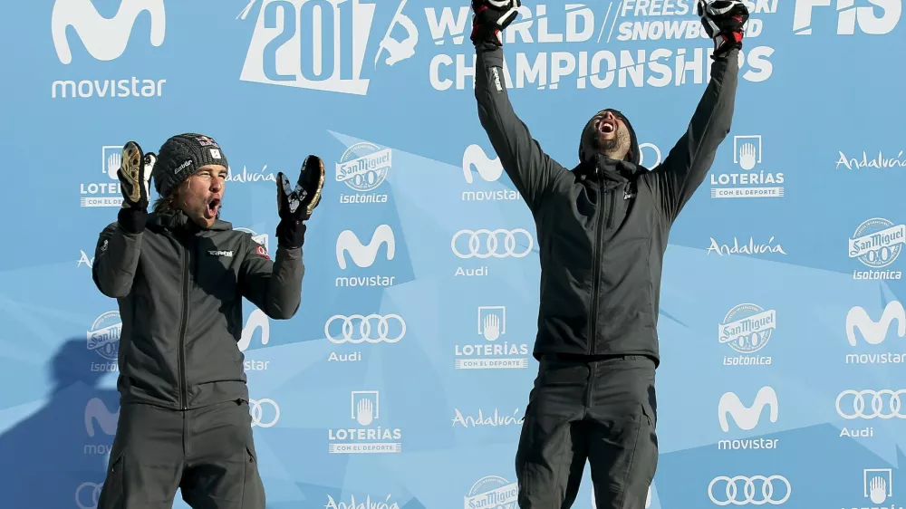 ﻿Snowboarding - FIS Snowboarding and Freestyle Skiing World Championships - Men's Snowboard Parallel Slalom - Sierra Nevada, Spain - 15/03/17 -  Gold medalist Andreas Prommegger of Austria (R) and silver medalist Benjamin Karl of Austria react on the podium. REUTERS/Albert Gea